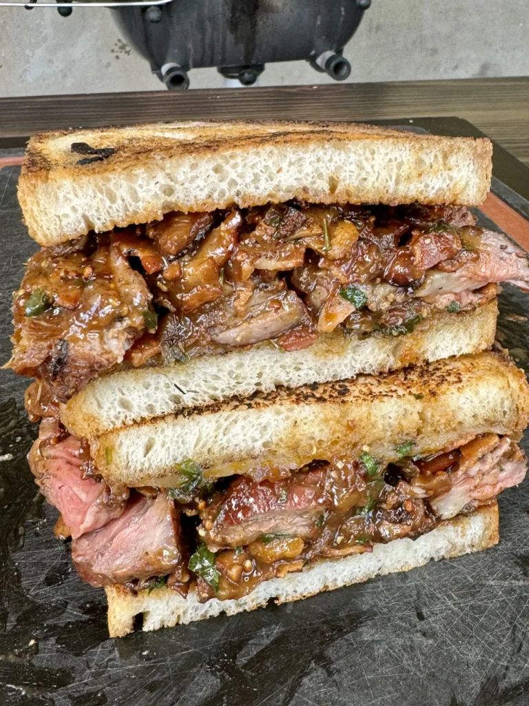 steak sandwich on a cutting board