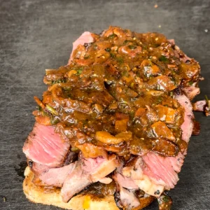 prepping the steak steak sandwich to be eaten