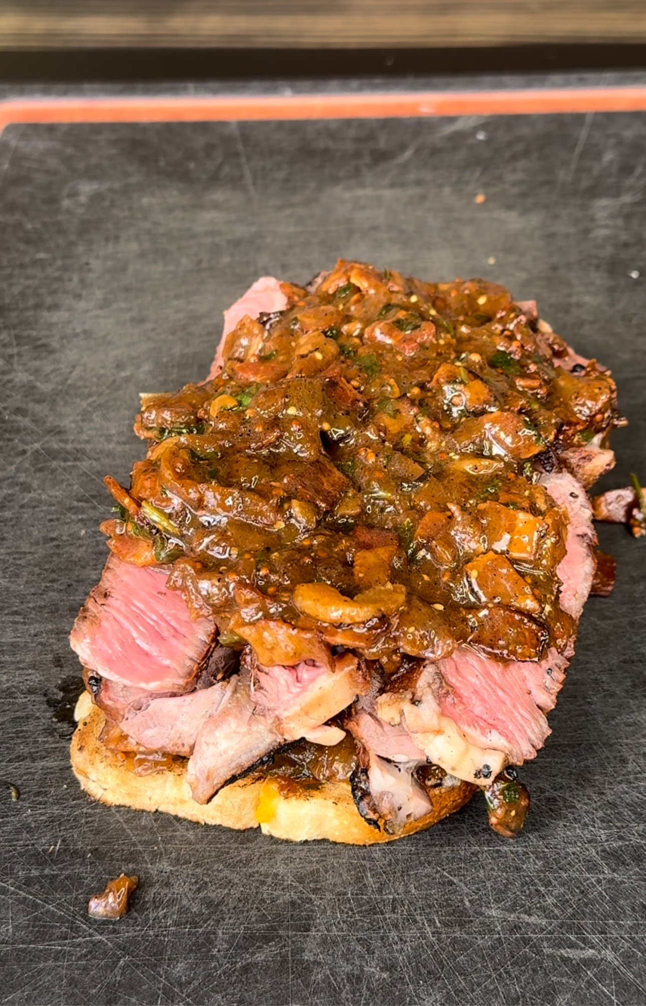 prepping the steak steak sandwich to be eaten