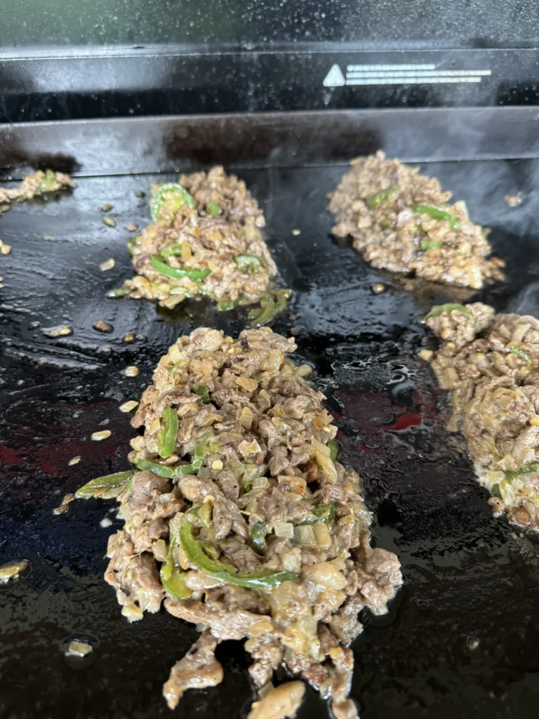 cheesesteaks on the grill