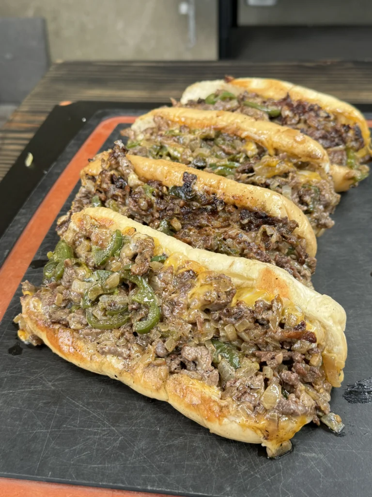 MORE SPICY CHEESESTEAKS ON THE CUTTING BOARD