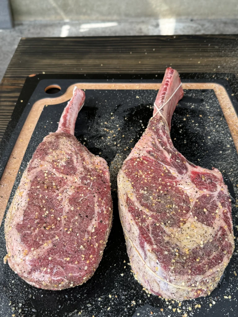 steaks on the cutting board getting ready to be cooked