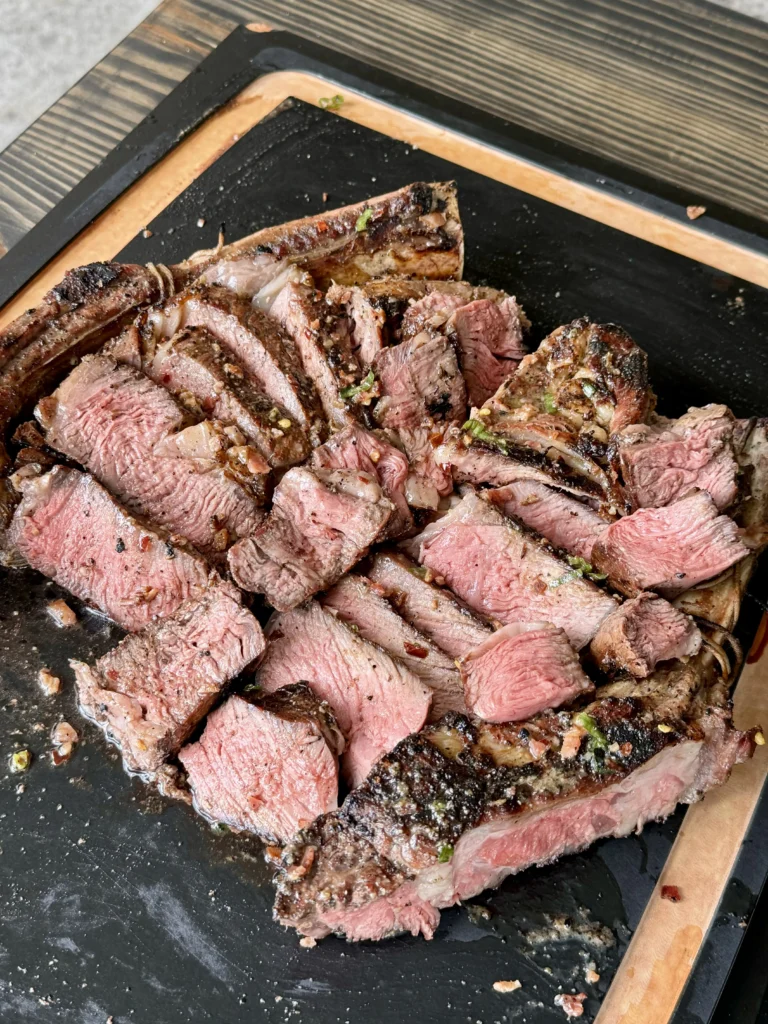 sliced steak on a cutting board