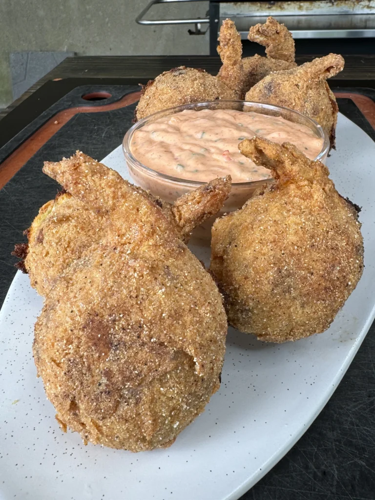 shrimp stuffed jalapeno poppers on a plate