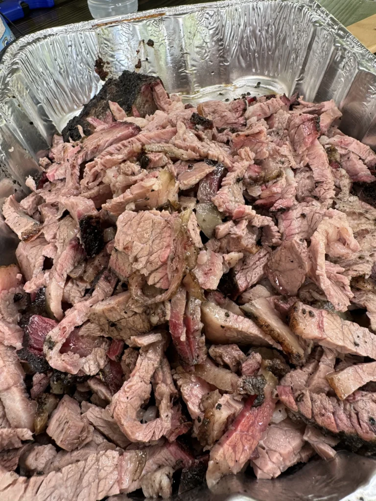 sliced brisket in a pan for cheesesteaks