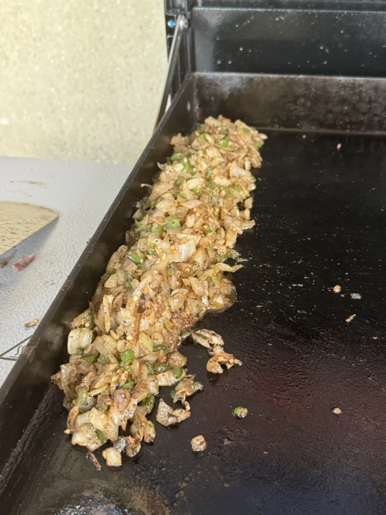 preparing the vegetables on the griddle