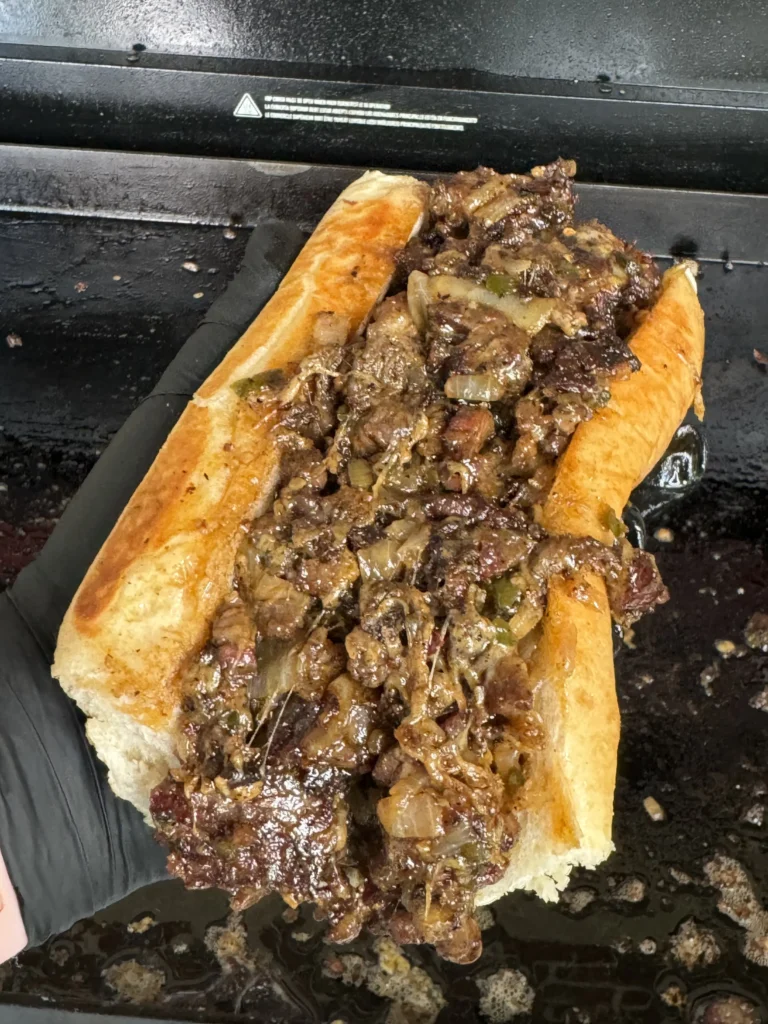 one brisket sandwich on the grill