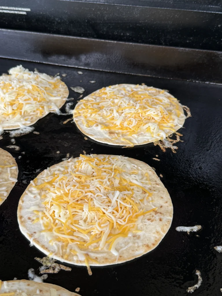 tortillas on the grill with cheese on the grill