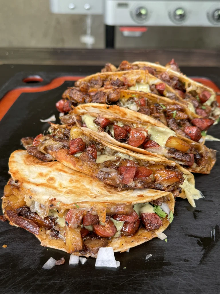 crispy pork belly tacos on the cutting board