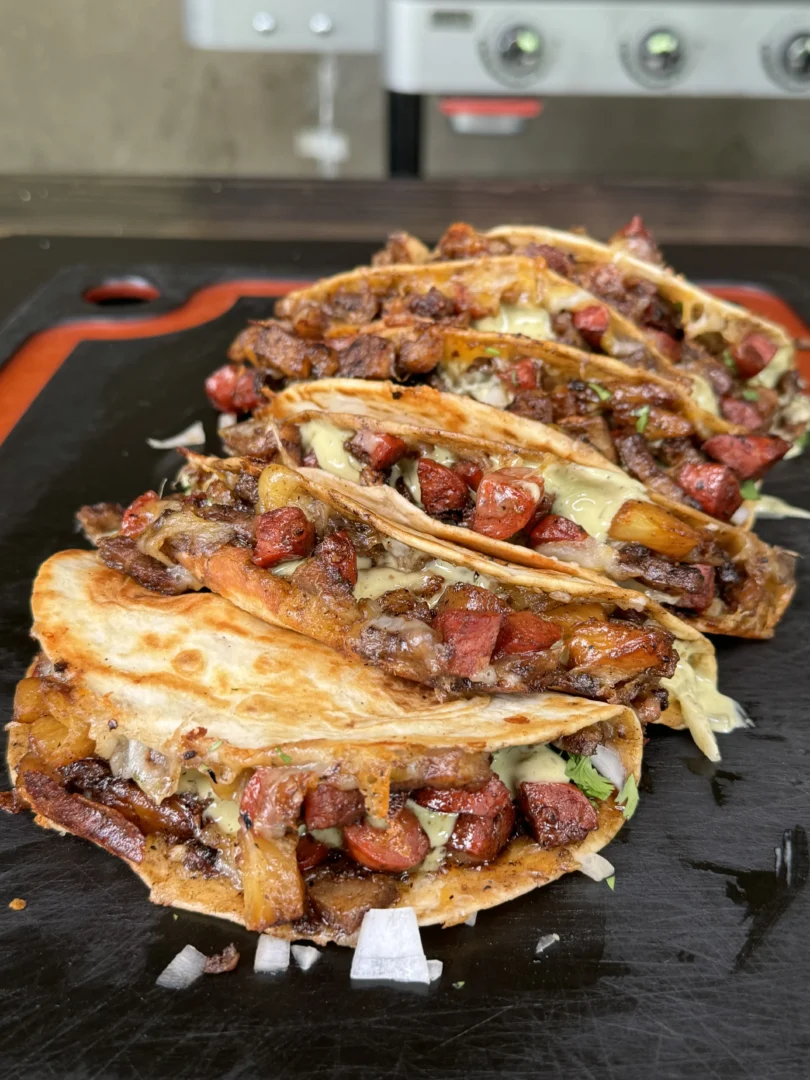 crispy pork belly tacos on the cutting board