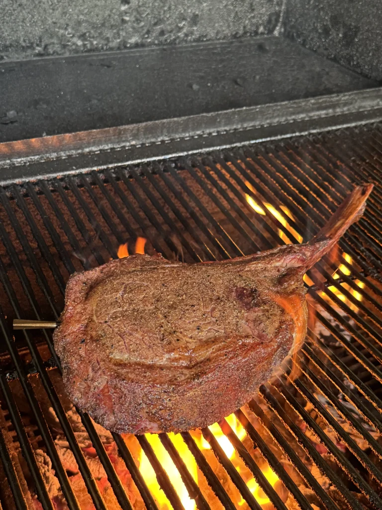 smoking the steak on the hasty bake