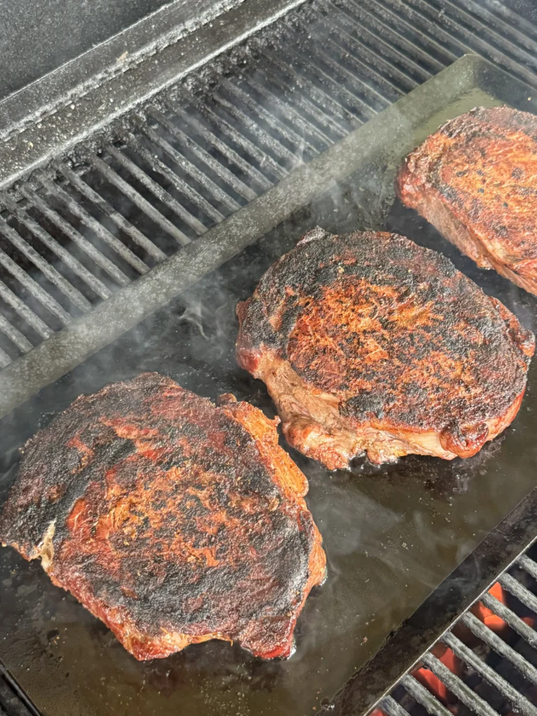 searing steaks on the cast iron