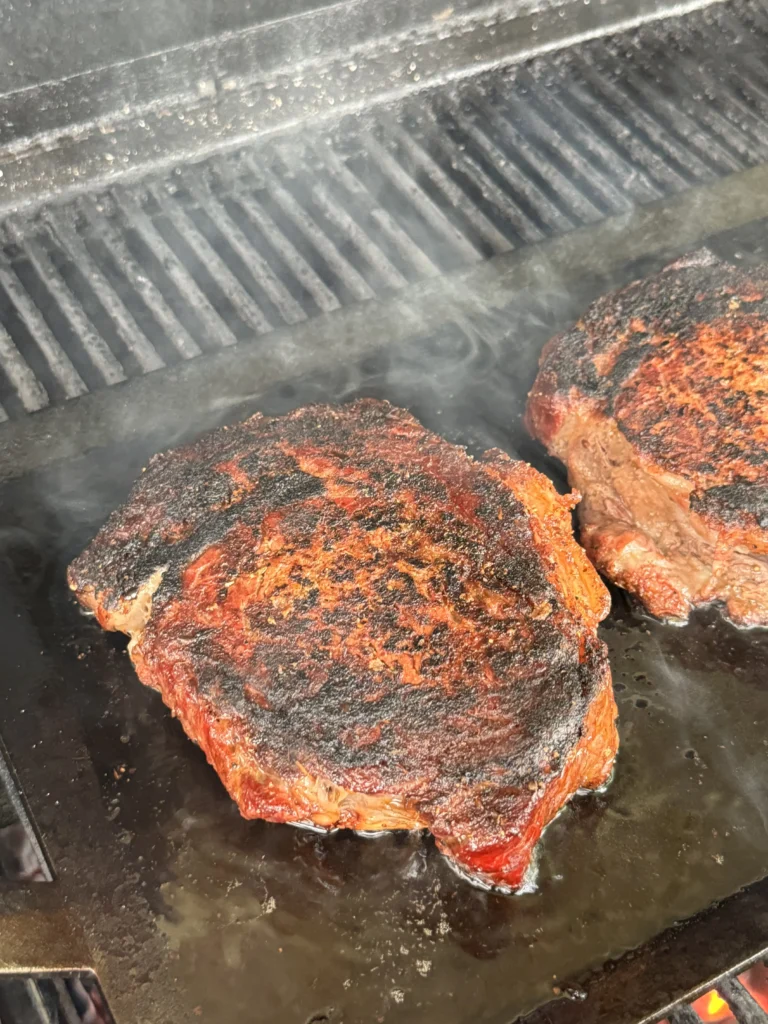seared ribeyes on cast iron