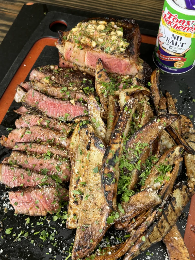 finished cajun steak and potato wedges