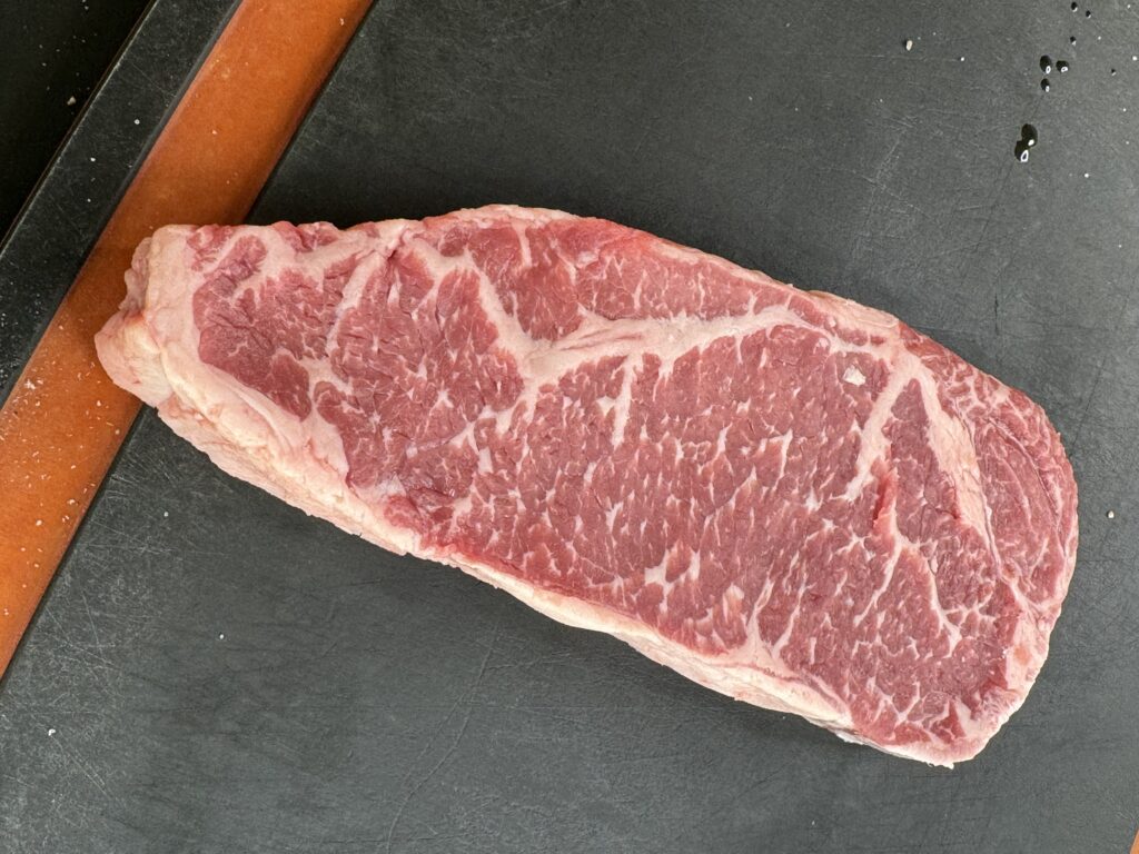 new york strip on the cutting board