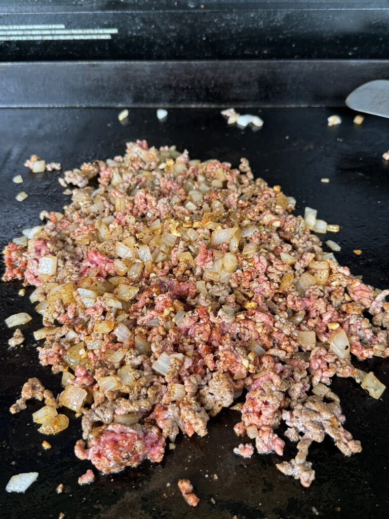 beef on the grill with onions
