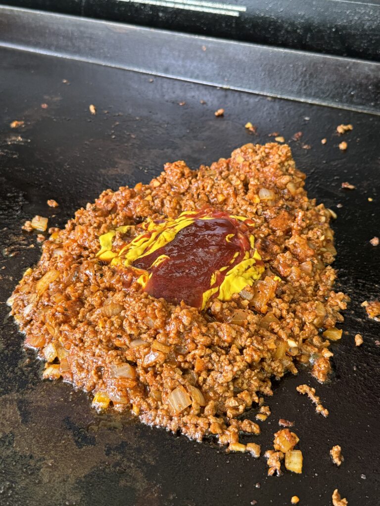 added tomato paste onto the meat