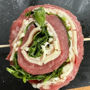 prepped steak pinwheel on a cutting board