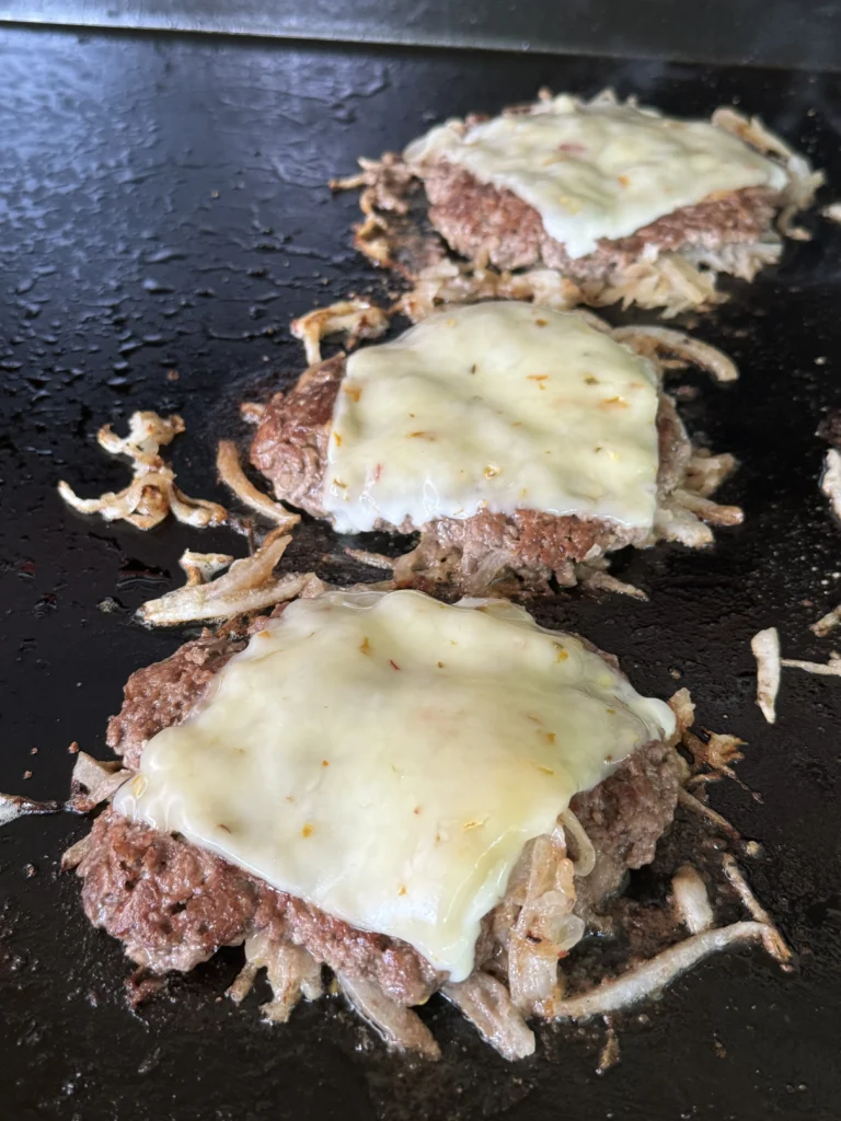 cheese melting on the burgers
