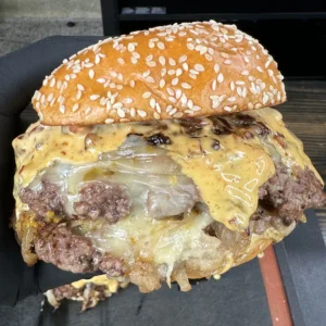 smash burgers in a hand