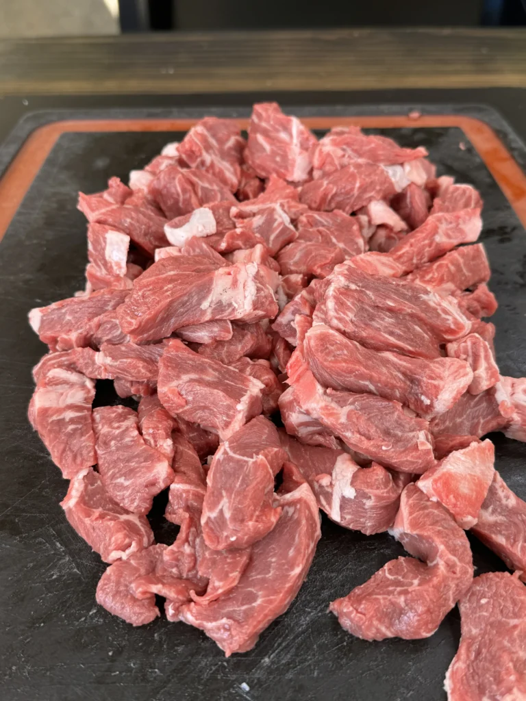 steak cut up on the cutting board