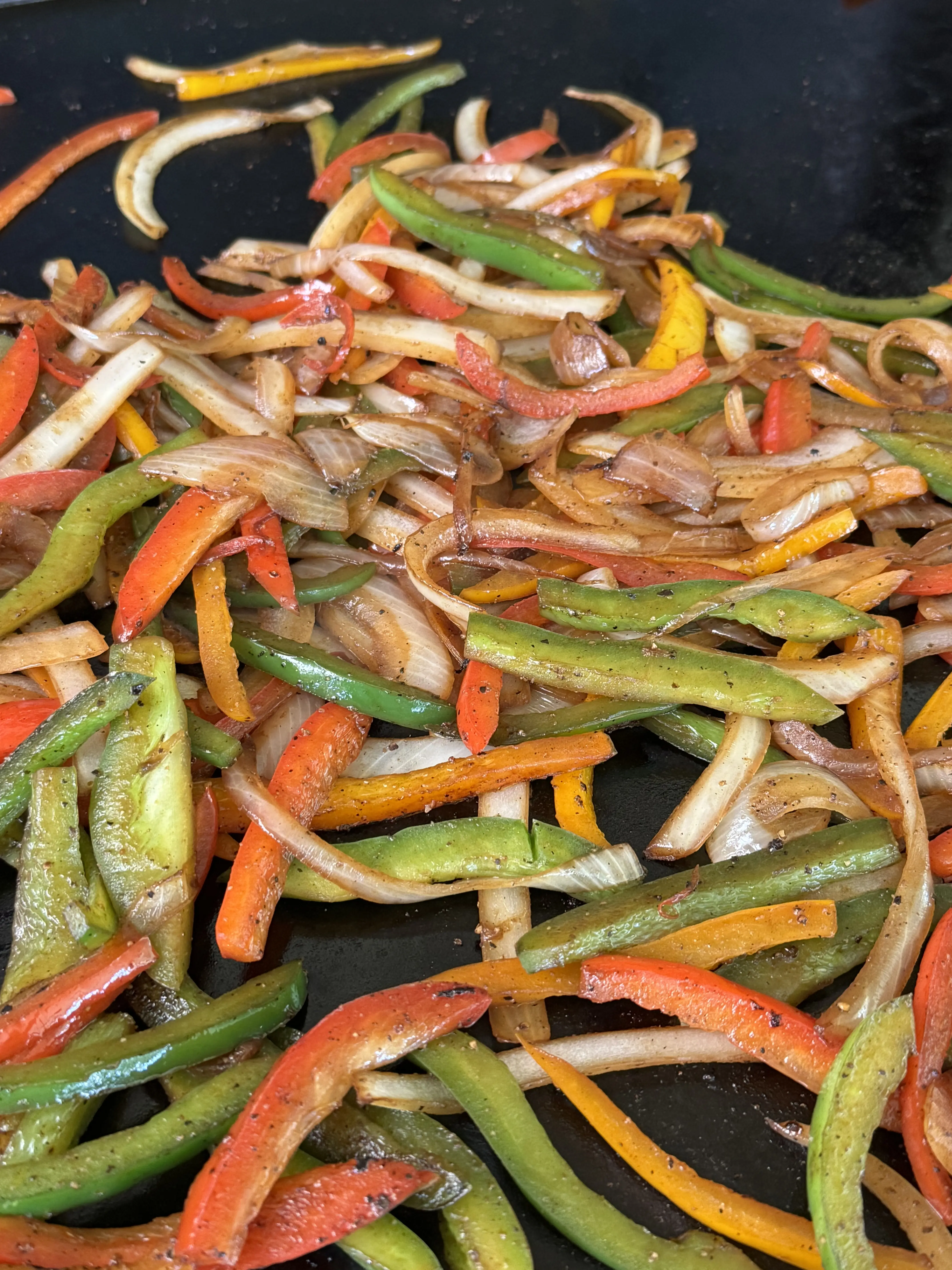 cooking vegetables on the flat top