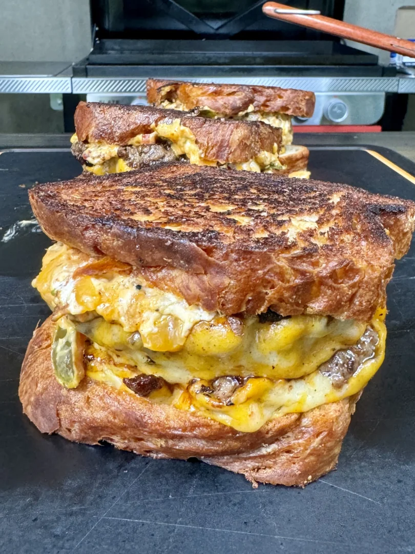 jalapeno popper patty melts on a cutting board