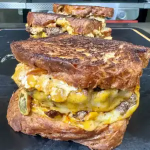 jalapeno popper patty melts on a cutting board