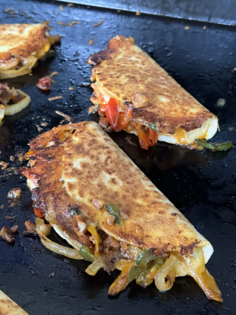 cooking tacos on the flat top