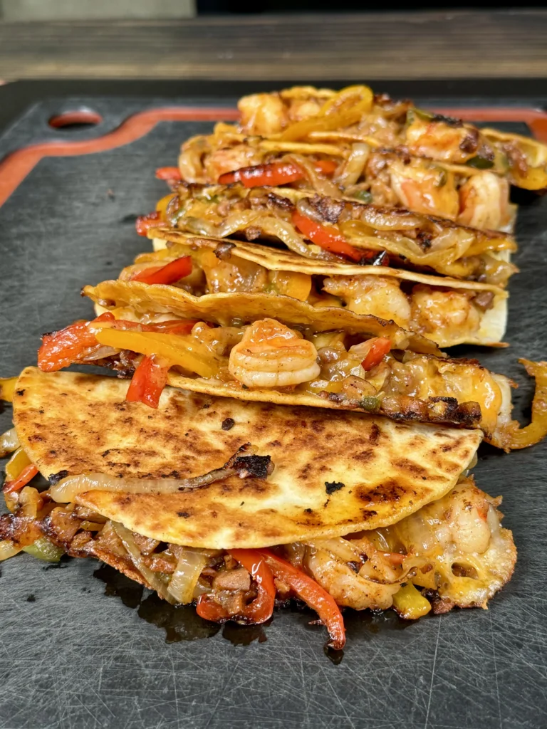 row of Andouille sausage and shrimp tacos