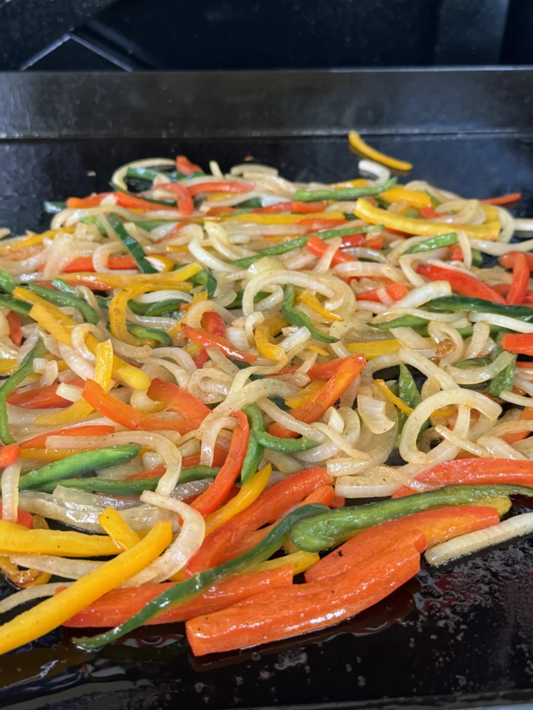cooking vegetables on the flat top