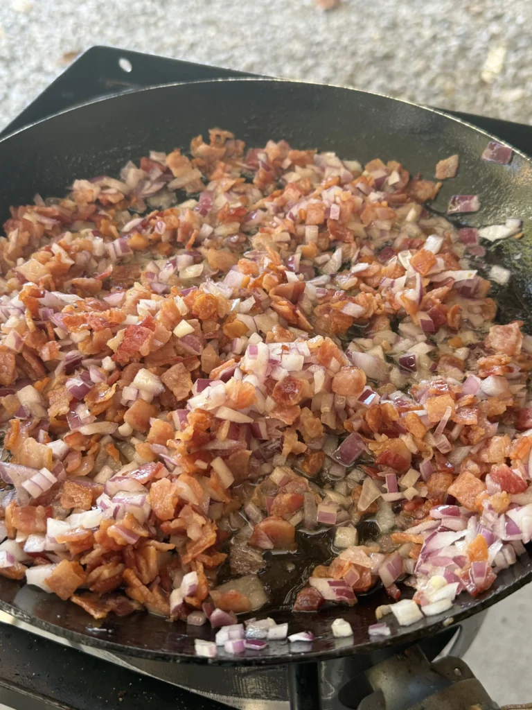 cooking bacon in the pan for bacon jam