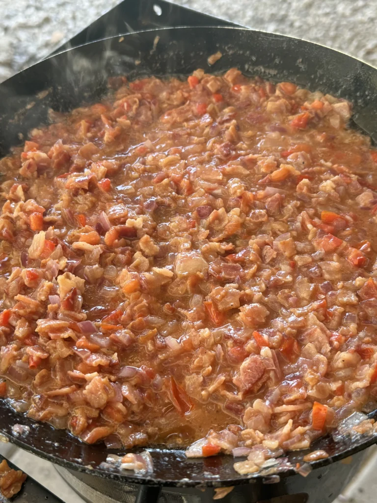 cooking bacon jam in a cast iron skillet