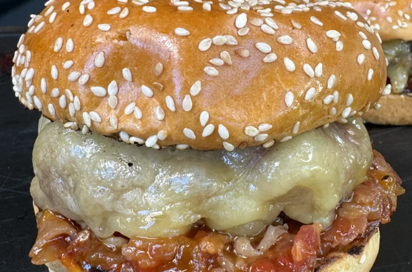 smoked bacon jam burgers on a cutting board
