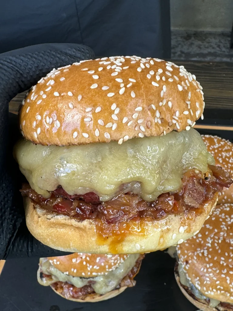 holding a bacon jam burger