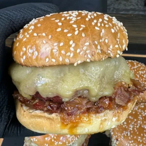 holding a bacon jam burger
