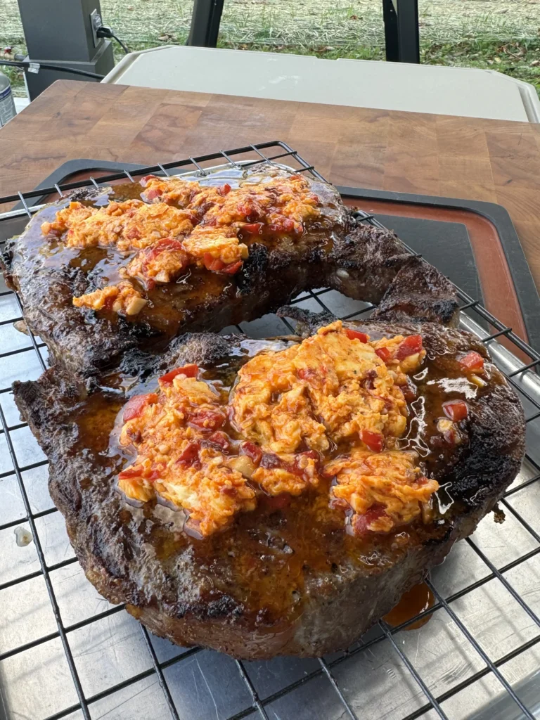 basting steaks on a grate