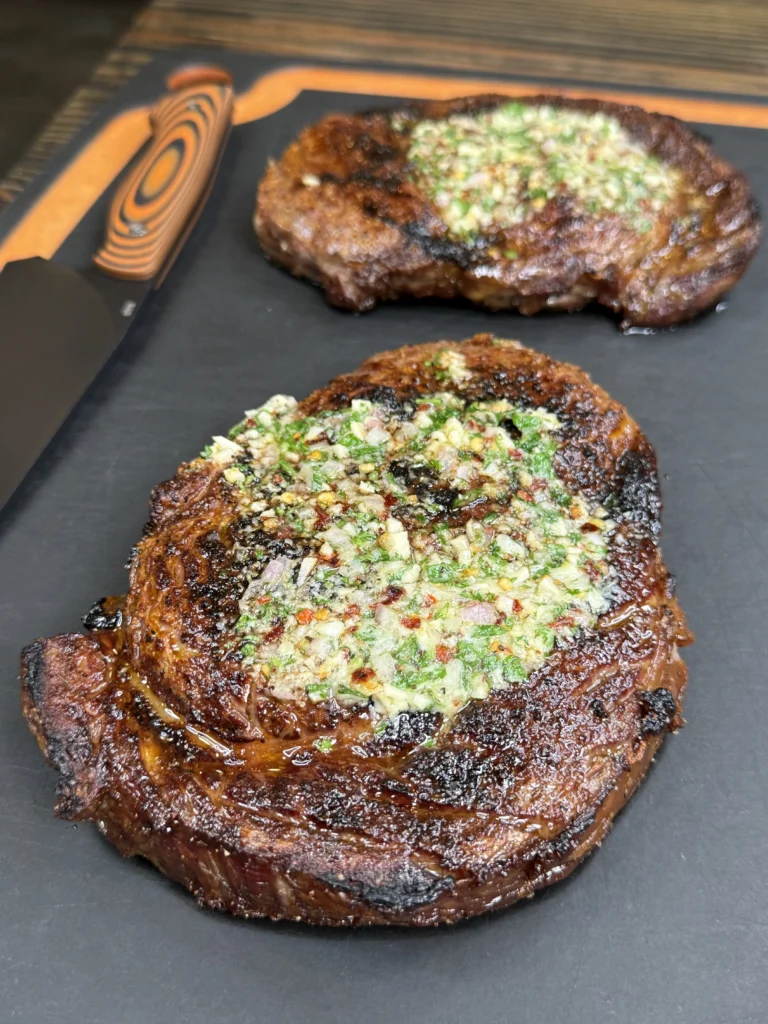 resting steaks on a cutting board
