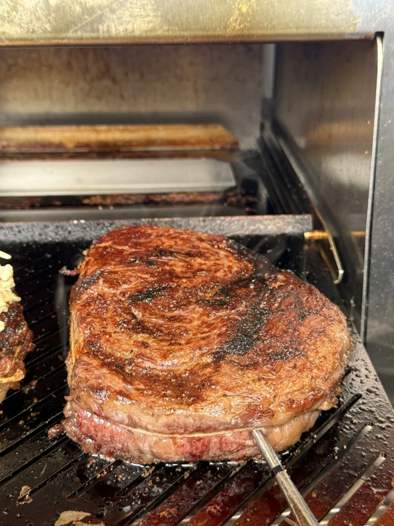 grilling steaks in the burner