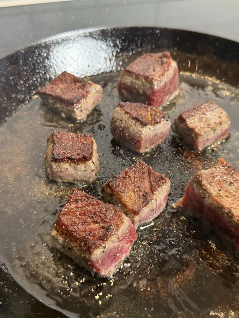 cooked new york strip in cast iron