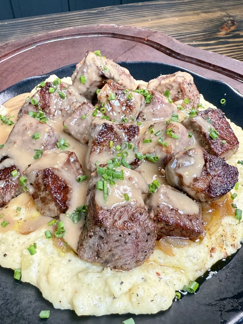 grilled steak with mashed potatoes and gravy