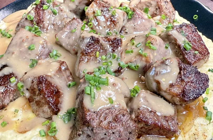 grilled steak with mashed potatoes and gravy