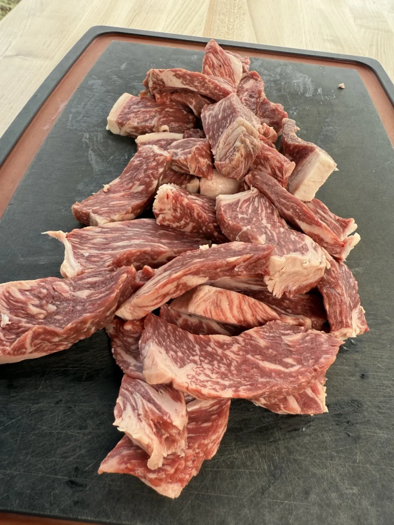 beef for the recipe on a cutting board