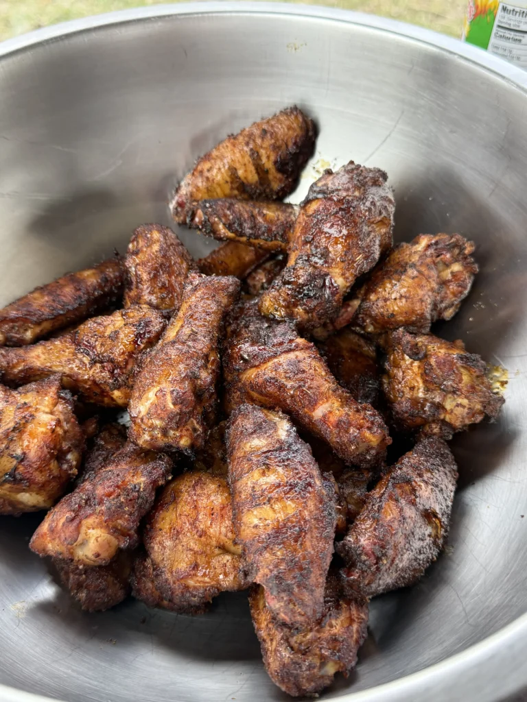 chicken wings in a bowl ready to be tossed