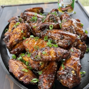 up close of the smoked chicken wings on a plate with Tony's seasoning