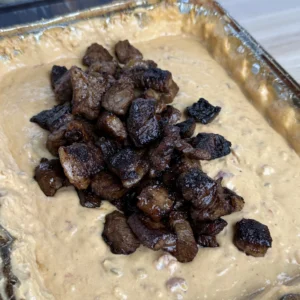 steak bites in the smoked queso