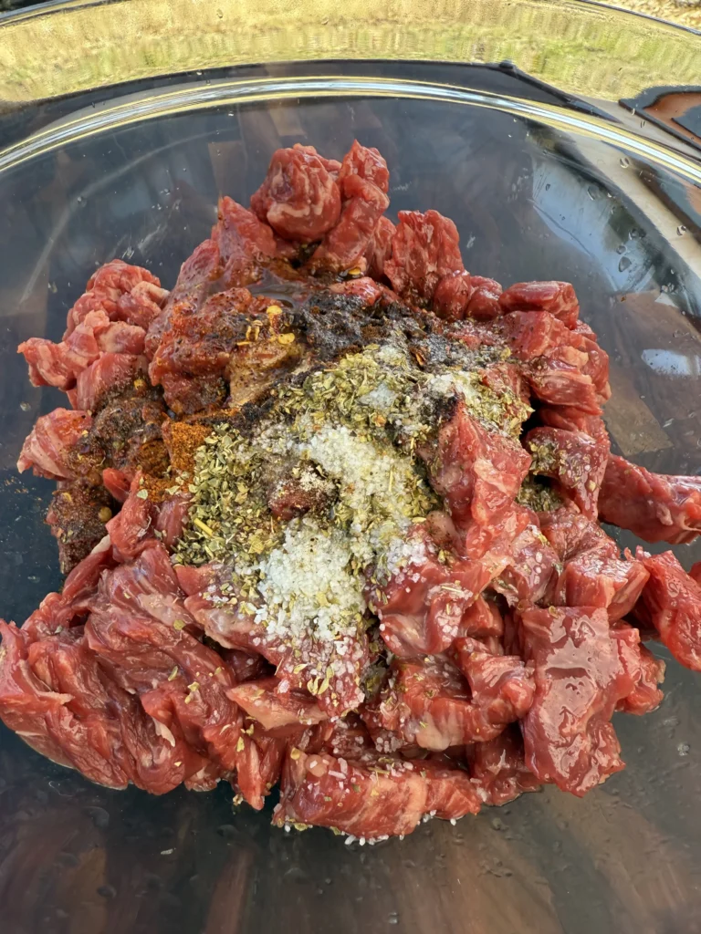 marinating steak in a clear bowl