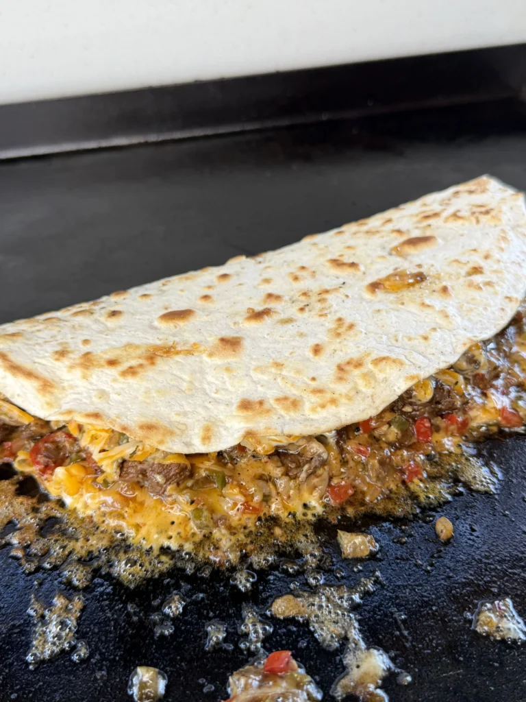 finalized steak quesadilla on the grill
