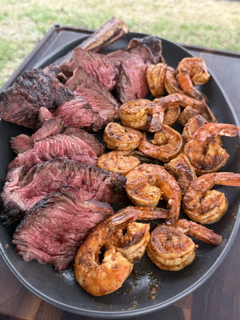 Steak and shrimp plated together with cowboy butter