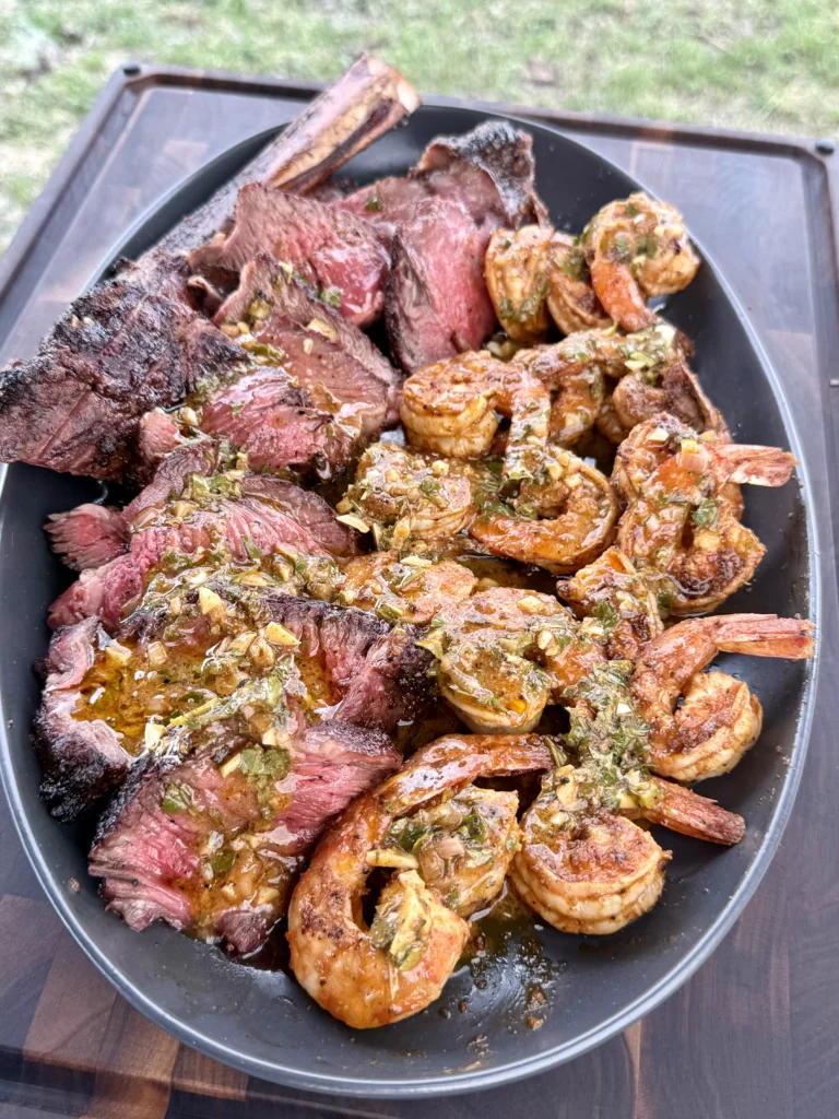 perfectly cooked steak and shrimp with cowboy butter